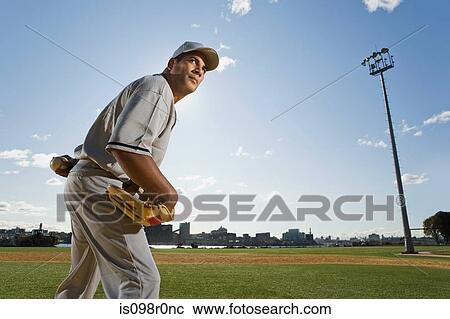 Baseball pitcher holding a baseball View Large Photo Image Stock Image - Baseball pitcher holding a baseball. Fotosearch