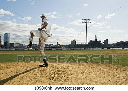 Baseball pitcher standing on one leg View Large Photo Image Stock Image - Baseball pitcher standing on one leg. Fotosearch