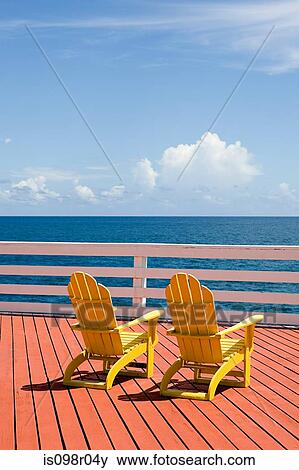 Chairs by the ocean View Large Photo Image Stock Photo - Chairs by the ocean. Fotosearch