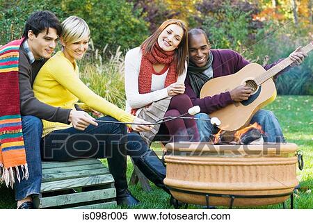 Friends having fun outdoors View Large Photo Image Stock Photography - Friends having fun outdoors. Fotosearch