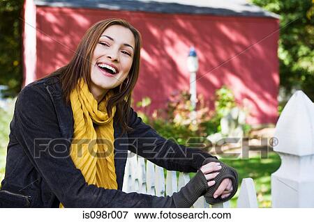 Stock Photo - Happy woman outdoors. Fotosearch