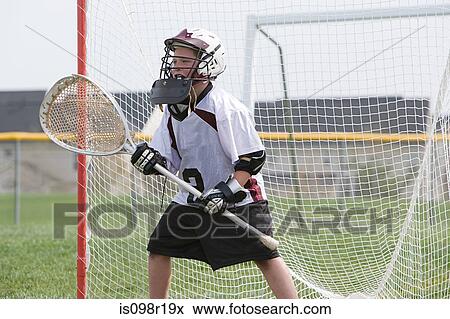 Junior lacrosse player in goal View Large Photo Image Stock Photo - Junior lacrosse player in goal. Fotosearch