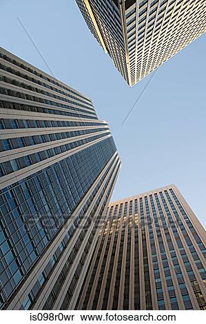 Low angle view of sky scrapers View Large Photo Image Stock Photography - Low angle view of sky scrapers. Fotosearch