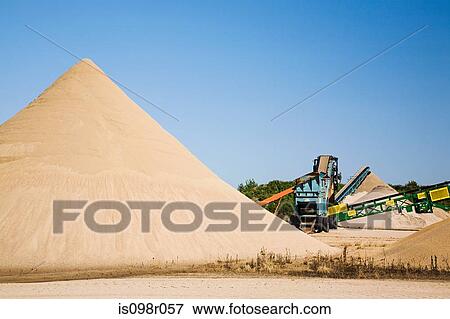 Stock Photo - Mounds of sand and conveyor belt. Fotosearch