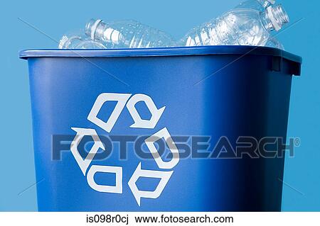 Stock Image - Plastic bottles in a recycling bin. Fotosearch