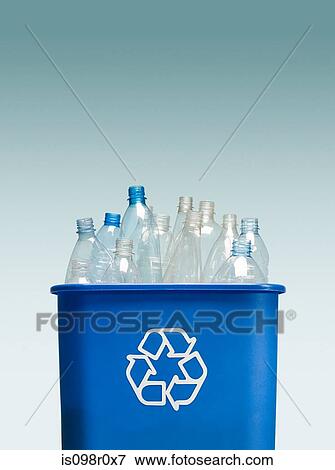 Stock Photo - Plastic bottles in a recycling bin. Fotosearch