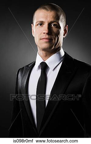 Portrait of a mid adult man wearing a suit View Large Photo Image Stock Image - Portrait of a mid adult man wearing a suit. Fotosearch
