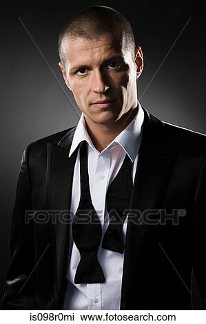 Portrait of a mid adult man wearing a dinner jacket View Large Photo Image Stock Image - Portrait of a mid adult man wearing a dinner jacket. Fotosearch