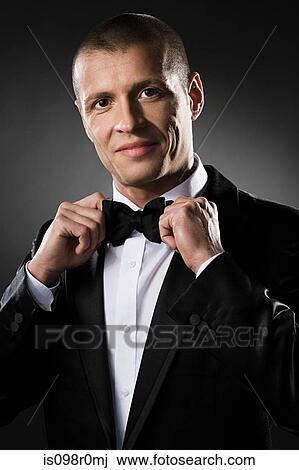 Portrait of a mid adult man wearing a dinner jacket View Large Photo Image Stock Image - Portrait of a mid adult man wearing a dinner jacket. Fotosearch