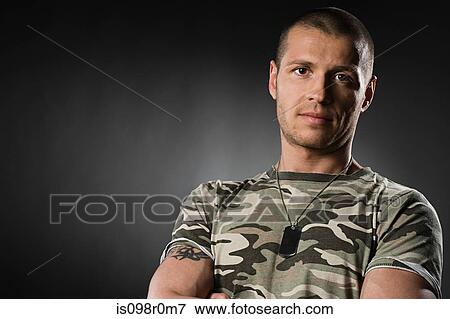 Portrait of a mid adult man wearing a dog tag View Large Photo Image Stock Photo - Portrait of a mid adult man wearing a dog tag. Fotosearch