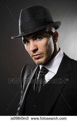 Portrait of a young man wearing a fedora View Large Photo Image Stock Image - Portrait of a young man wearing a fedora. Fotosearch