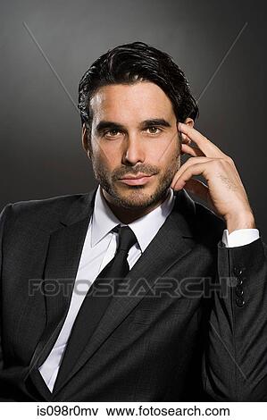Stock Photo - Profile of a young man wearing a suit. Fotosearch