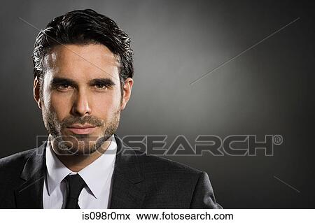 Profile of a young man wearing a suit View Large Photo Image Stock Photo - Profile of a young man wearing a suit. Fotosearch