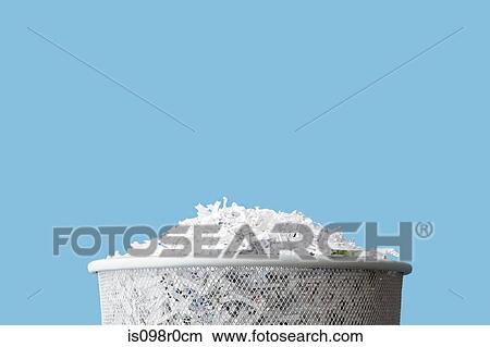 Picture - Shredded paper in a bin. Fotosearch