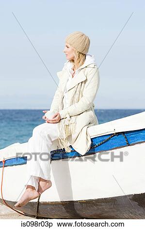 Woman and boat by the sea View Large Photo Image Stock Photography - Woman and boat by the sea. Fotosearch