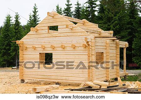 Wooden cabin under construction View Large Photo Image Stock Photo - Wooden cabin under construction. Fotosearch