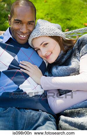 Young couple outdoors View Large Photo Image Picture - Young couple outdoors. Fotosearch