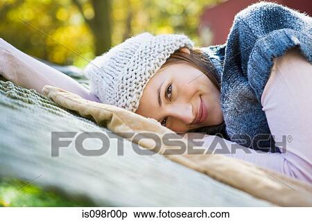 Stock Photography - Young woman on hammock. Fotosearch