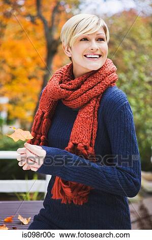 Young woman with leaf View Large Photo Image Stock Image - Young woman with leaf. Fotosearch