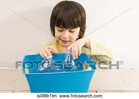 A boy holding a recycling bin View Large Photo Image Picture - A boy holding a recycling bin. Fotosearch