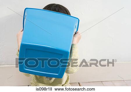 A boy holding a recycling bin View Large Photo Image Stock Image - A boy holding a recycling bin. Fotosearch