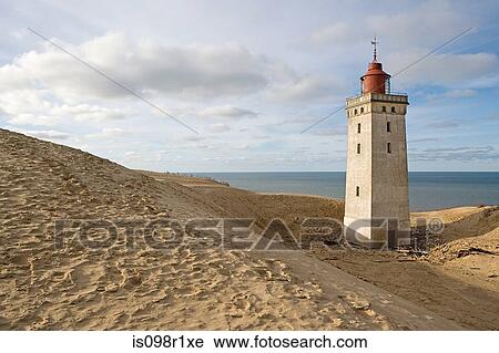 A lighthouse on a beach View Large Photo Image Stock Image - A lighthouse on a beach. Fotosearch
