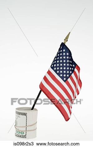 Stock Image - American flag and banknotes. Fotosearch