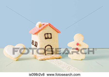 Biscuit house and gingerbread woman View Large Photo Image Stock Photo - Biscuit house and gingerbread woman. Fotosearch
