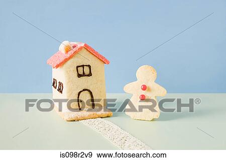 Biscuit house and gingerbread woman View Large Photo Image Stock Photo - Biscuit house and gingerbread woman. Fotosearch