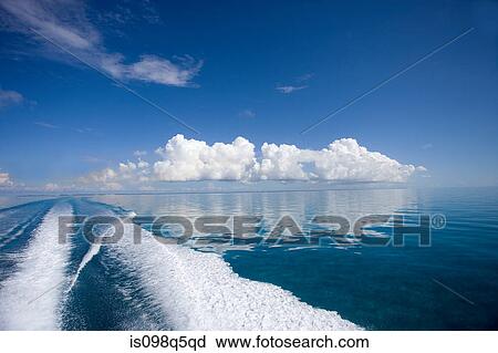 Boat wake on calm ocean. View Large Photo Image Stock Image - Boat wake on calm ocean.. Fotosearch