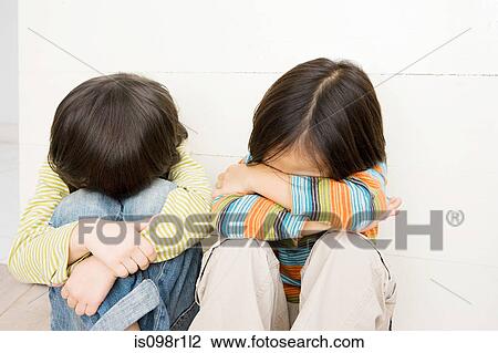 Boys covering their faces View Large Photo Image Stock Image - Boys covering their faces. Fotosearch