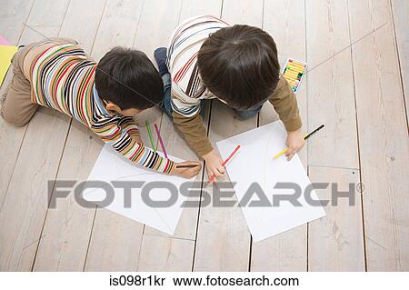 Stock Photography - Boys drawing with colouring pencils. Fotosearch