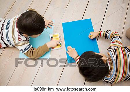 Boys drawing with crayons View Large Photo Image Picture - Boys drawing with crayons. Fotosearch