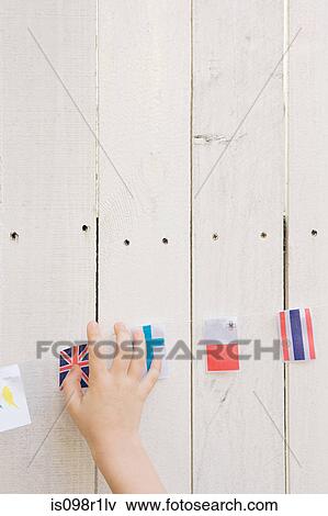 Childs hand and flags View Large Photo Image Stock Photo - Childs hand and flags. Fotosearch