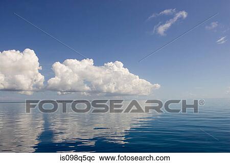 Clouds above calm ocean. View Large Photo Image Stock Image - Clouds above calm ocean.. Fotosearch