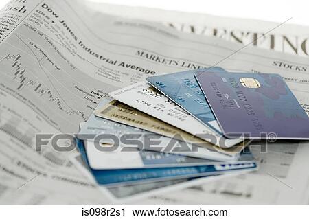 Credit cards and newspaper View Large Photo Image Stock Image - Credit cards and newspaper. Fotosearch