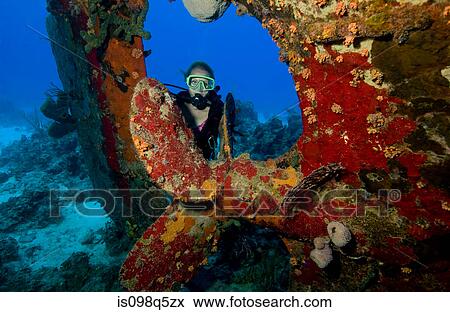 Stock Photo - Diver on shipwreck.. Fotosearch