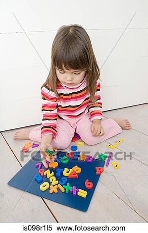 Girl playing with magnets View Large Photo Image Stock Photography - Girl playing with magnets. Fotosearch