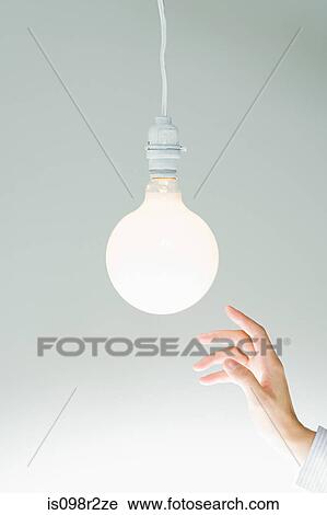 Hand and lightbulb View Large Photo Image Stock Image - Hand and lightbulb. Fotosearch