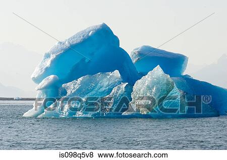 Iceberg calved from glacier. View Large Photo Image Stock Photo - Iceberg calved from glacier.. Fotosearch