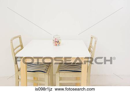 Jar of sweets on a table View Large Photo Image Stock Photo - Jar of sweets on a table. Fotosearch