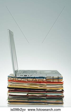Laptop on files View Large Photo Image Stock Photo - Laptop on files. Fotosearch