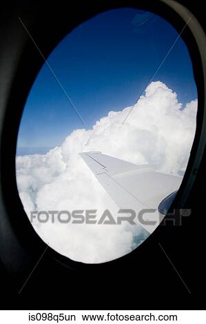 Looking out airplane window. View Large Photo Image Picture - Looking out airplane window.. Fotosearch
