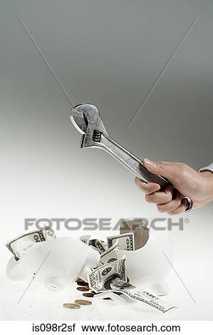 Person smashing piggy bank View Large Photo Image Stock Image - Person smashing piggy bank. Fotosearch