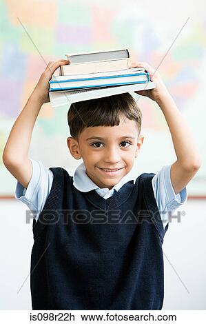 Schoolboy with books View Large Photo Image Stock Image - Schoolboy with books. Fotosearch