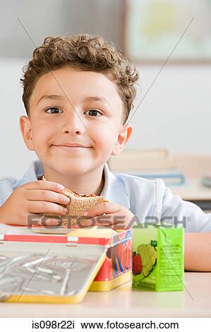 Schoolboy with packed lunch View Large Photo Image Stock Image - Schoolboy with packed lunch. Fotosearch