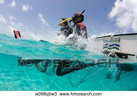 Snorkelers jump into water. View Large Photo Image Stock Image - Snorkelers jump into water.. Fotosearch