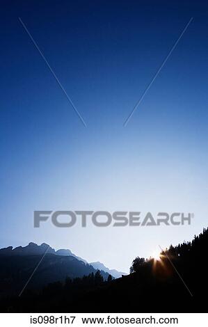 Sunrise over mountains in vals View Large Photo Image Stock Photo - Sunrise over mountains in vals. Fotosearch