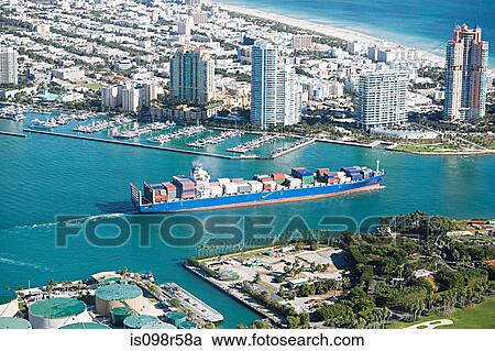Stock Image - Cargo ship in harbour. Fotosearch
