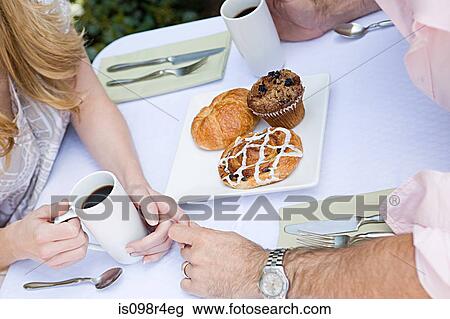 Couple having breakfast outdoors View Large Photo Image Stock Image - Couple having breakfast outdoors. Fotosearch